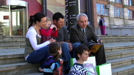 The winning family look over their Pompeii prize pack