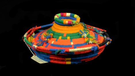 A unique basket woven with wool in multicoulours.