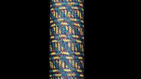 A long bamboo cylinder covered with plaited weaving in split bamboo.