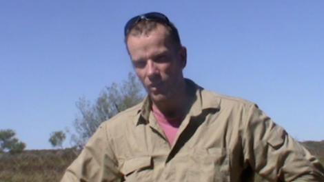 Mikael Siversson talking to camera in the Australian outback