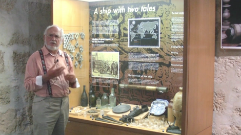 Patrick Baker standing at a photography exhibition