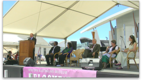 Speakers gathered on a stage for the launch of the Welcome Walls