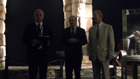 Three dignitaries at the site of an official handover ceremony