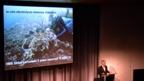 Doctor Ian MacLeod giving a lecture in the Maritime Museum in front of a screen