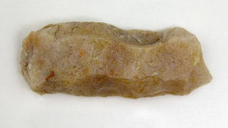 A stone artefact with resin