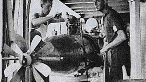 HMAS Sydney (II) crew attend to the torpedo deck