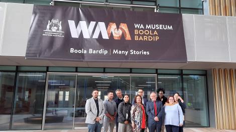 A group of people standing at the main entrance of WA Museum Boola Bardip