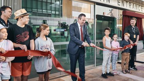 The Premier of Western Australia cuts a red ribbon at the New Museum entrance
