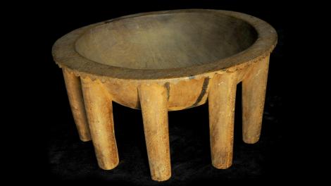 A wooden kava bowl with many legs