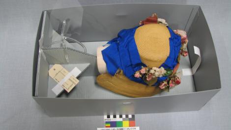 Performing textiles conservation work on a bonnet