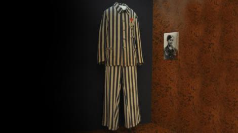 A museum display of a uniform worm in a concentration camp