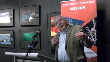 Sir David Attenborough standing at a podium