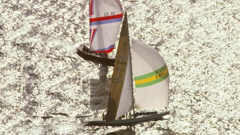 Australia II and Liberty sailing around the America’s Cup Buoy