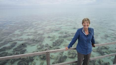 Professor Lyn Beazley in front of large stromatolite formations