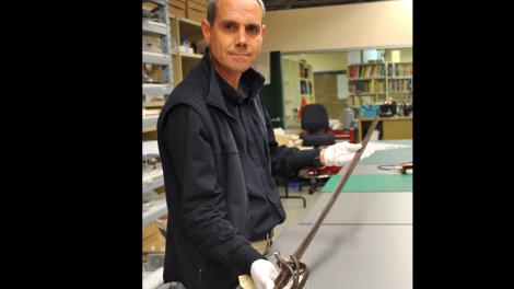Stephen Anstey holding a sword