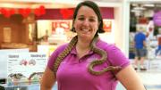 "A woman with a snake around her neck."