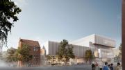 A view of the New Museum from the eastern end of Francis Street.  There is a heritage building to the left of the image with square, contemporary architecture to the right.  People are crossing the road to get to the Museum.