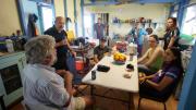 The expedition crew gathered around a dining table