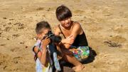 Image of Sidney with camera, and Chunna crouching next to him