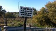 A sign reads "Keep out! WA Museum Mammal Dept Burial Area".