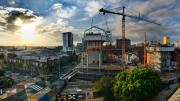 A crane lifts materials to the upper level of the new museum 