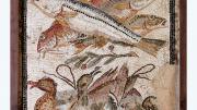 "A intricately tiled fresco depicting three large fish with gaping mouths, located above three ducks huddled together."
