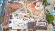 Aerial view of the site.  The Beaufort Street heritage building is to the left, crane in the middle and construction of the lifts and galleries is under way. 