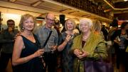 fashionable guests posing at the museum for the Costarella and Frock stars exhibition launch