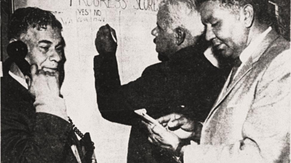 Men checking results over the telephone with the WA Electoral Office