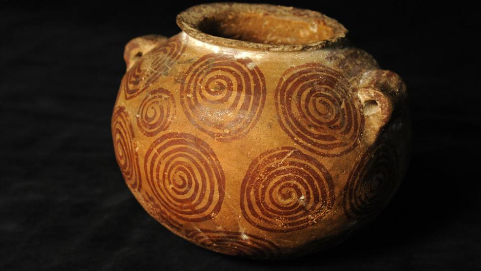 Close-up photo of an ancient clay pot
