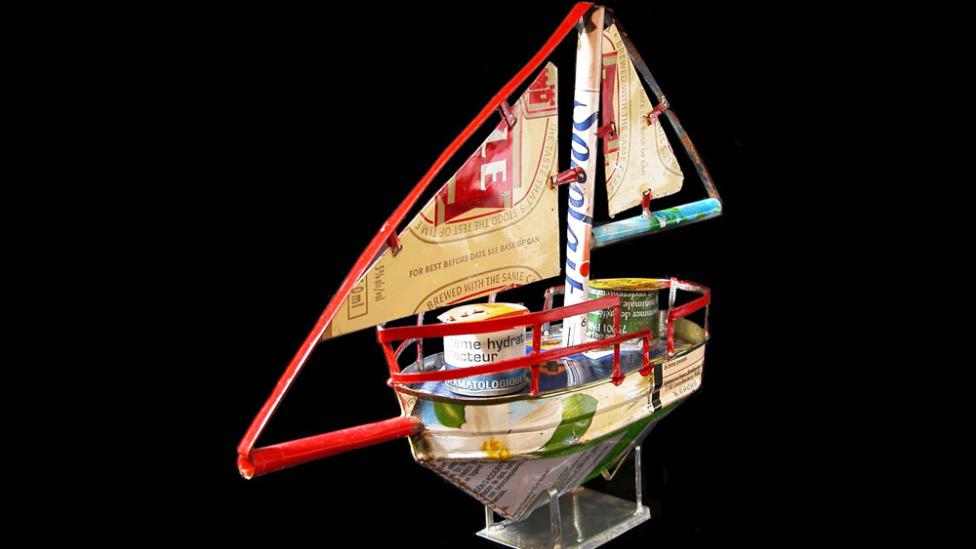A small boat constructed from found materials