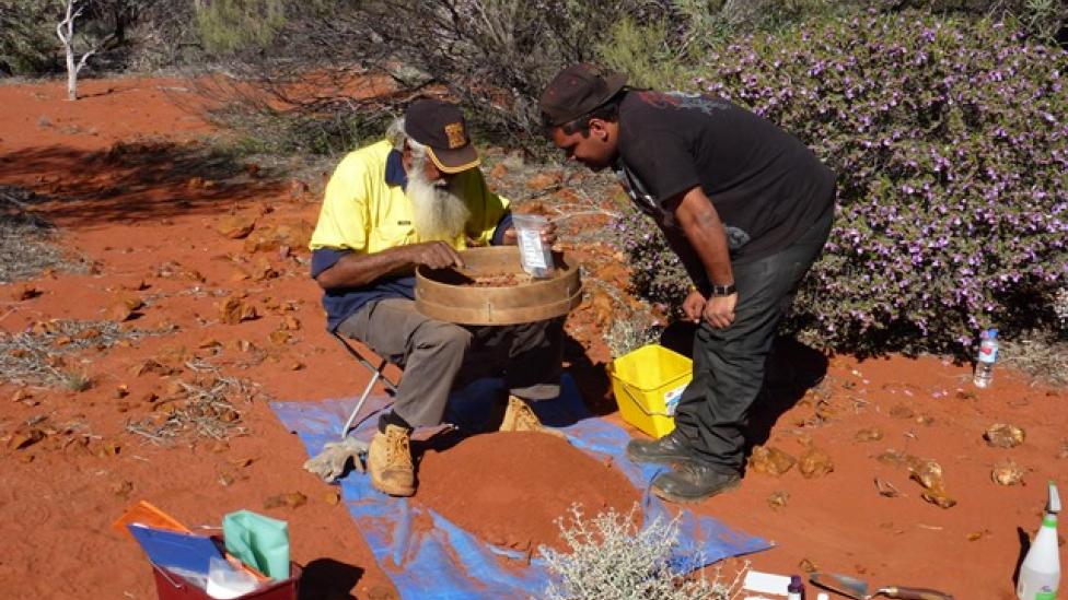 Archaeologists examining ochre