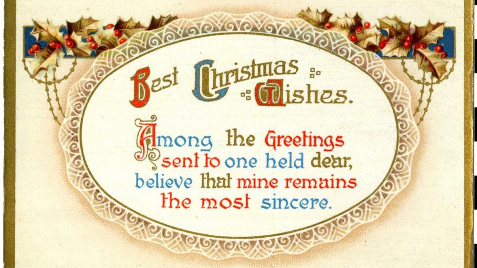 "Holly and gold border surrounds Christmas text."