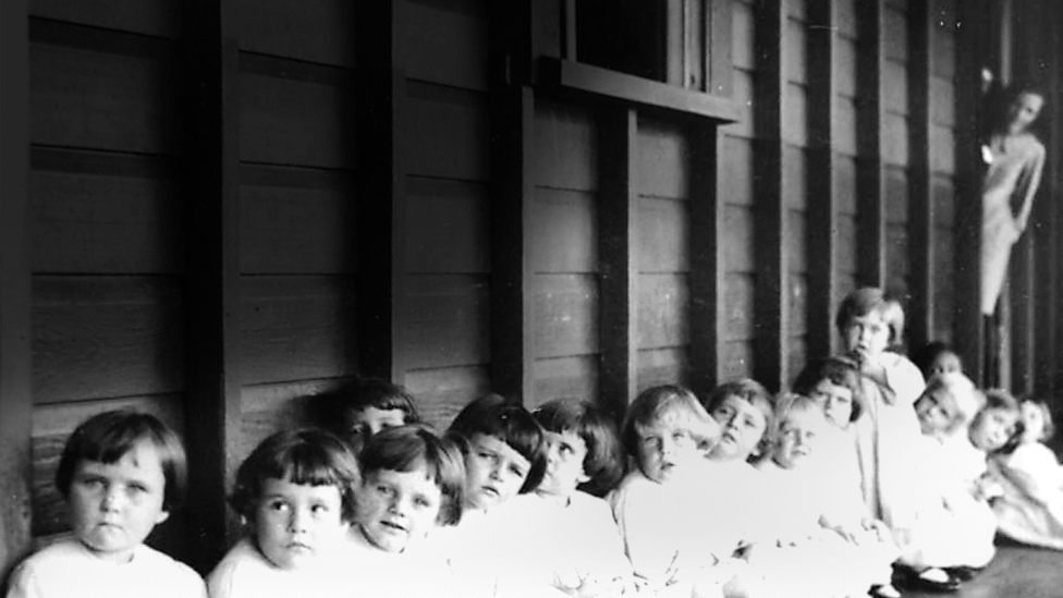 Small children waiting to be immunised at Nudgee Orphanage, Brisbane, about 1928