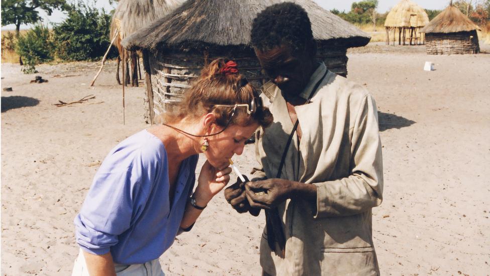 Karen Posing with locals’ on Zambia’s Barotse Plains, near the Angolan border.