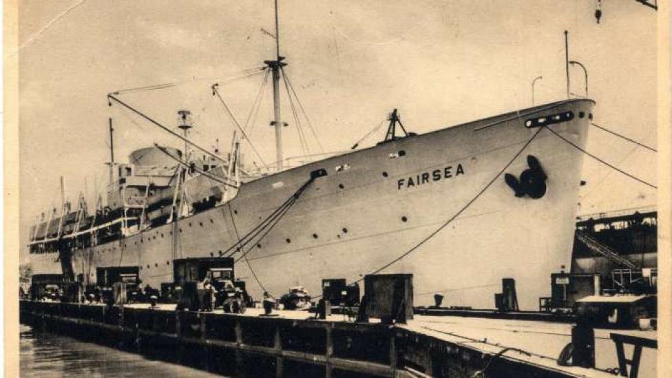 A large boat leaving port