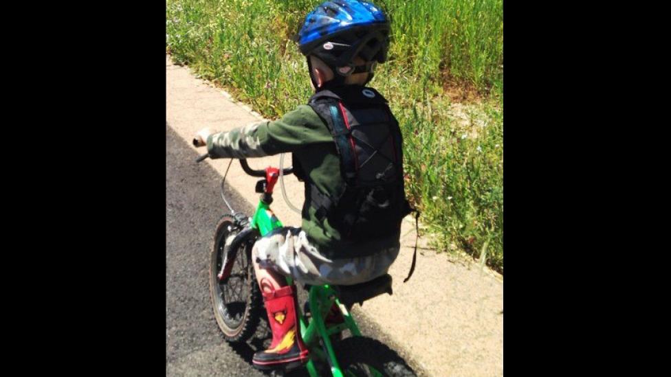 A small child riding a bike