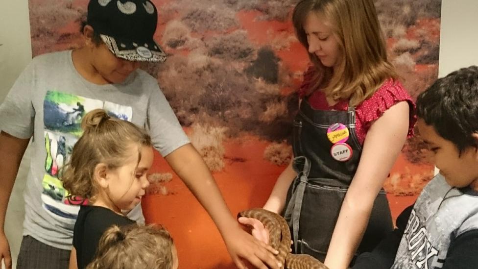 Group of children meeting a snake