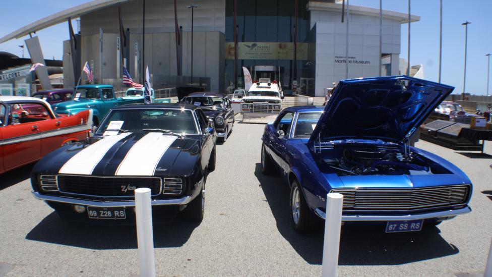 Vintage and custom cars on display outside the Maritime Museum