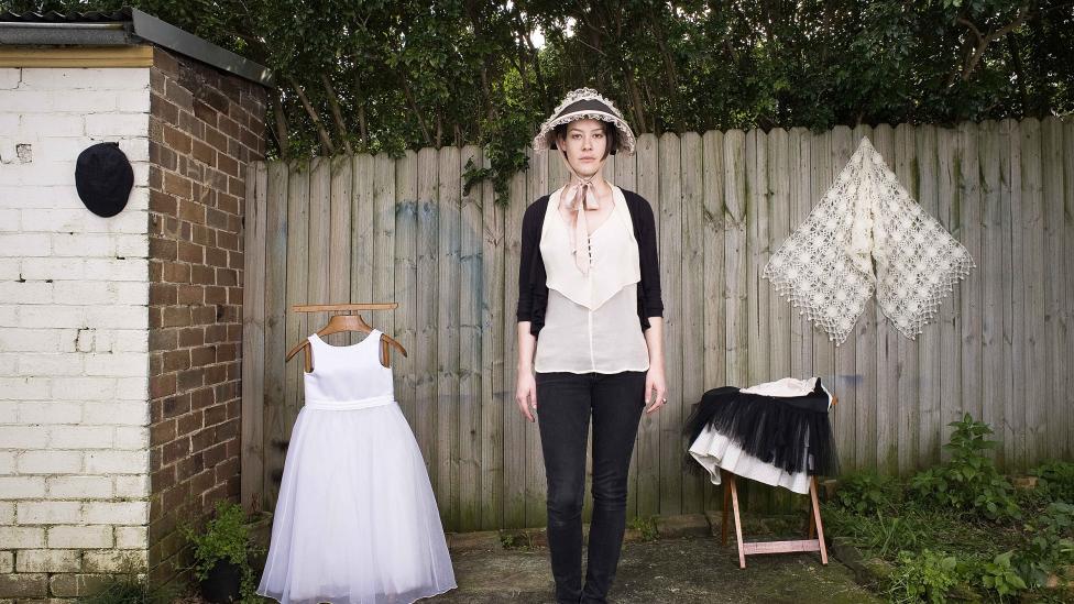 A model posing with stolen items