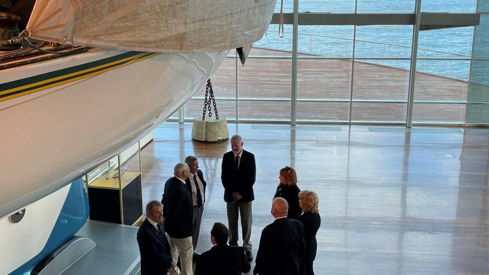 Eileen Bond and crew members take a sneak peek during filming for the new Australia II: 40 Years On exhibition film.