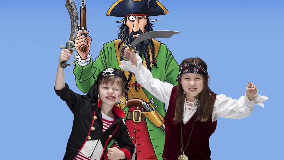 Children dressed up as pirates with one of the characters from Horrible Histories