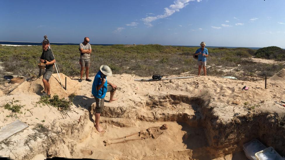 Researchers carefully excavating burial site at Beacon Island