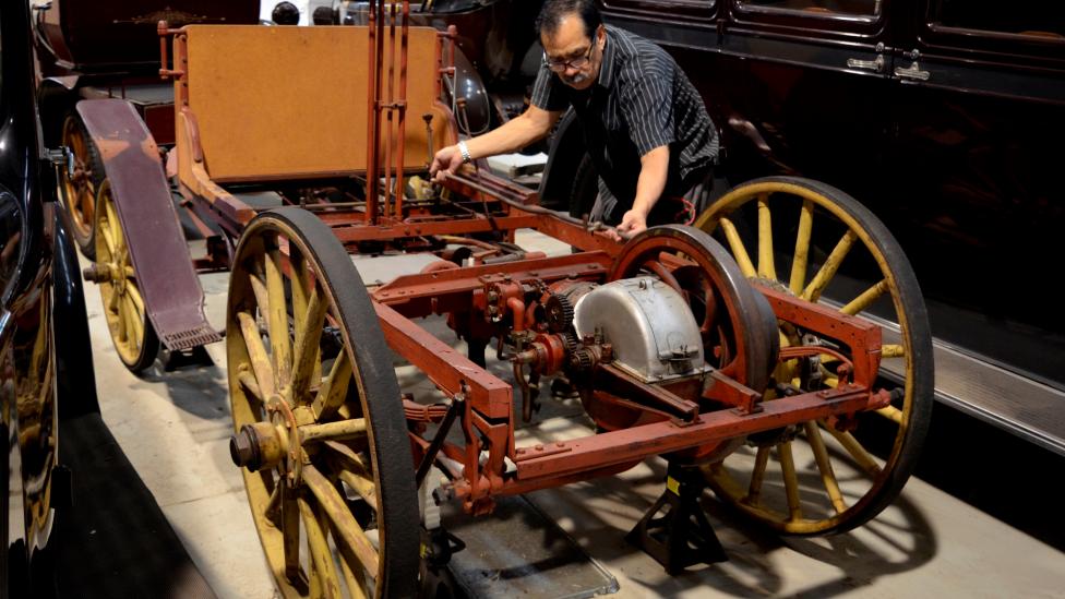 Western Australian Museum Technical Officer Salvador Gomez examining the car