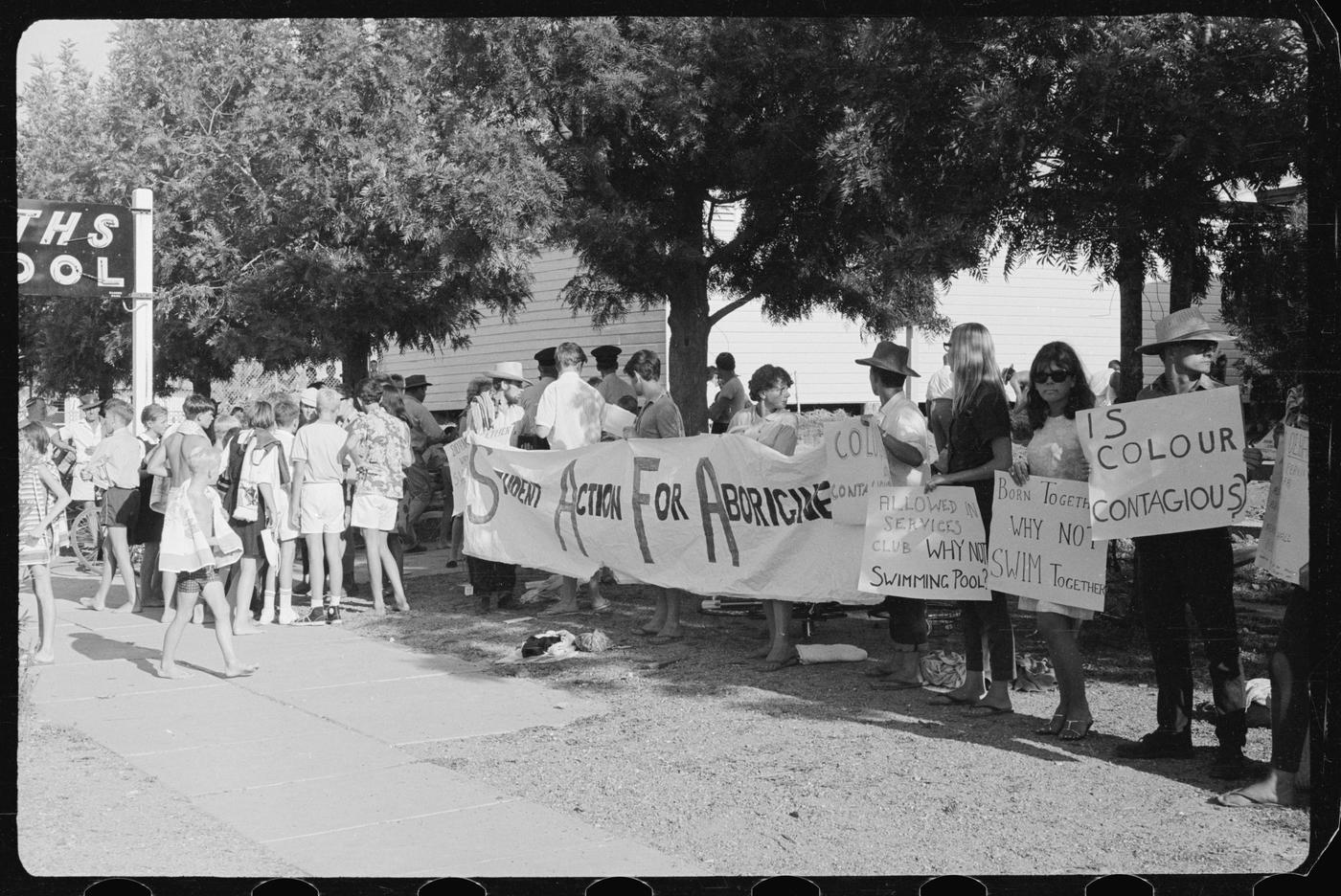 1965 Freedom Ride participants demonstrate against refusal to allow local Aboriginal children into the swimming pool in Moree. Their actions drew national and international attention to relationships between Aboriginal and non-Aboriginal people.