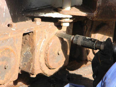 Equipment used to remove loose corrosion