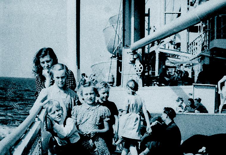 Mother and children onboard a ship bound for Australia